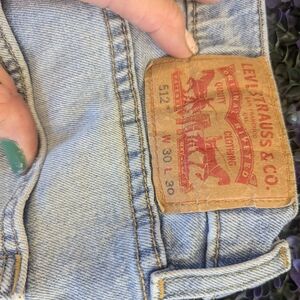 Levi's light blue denim jeans with tan leather patch